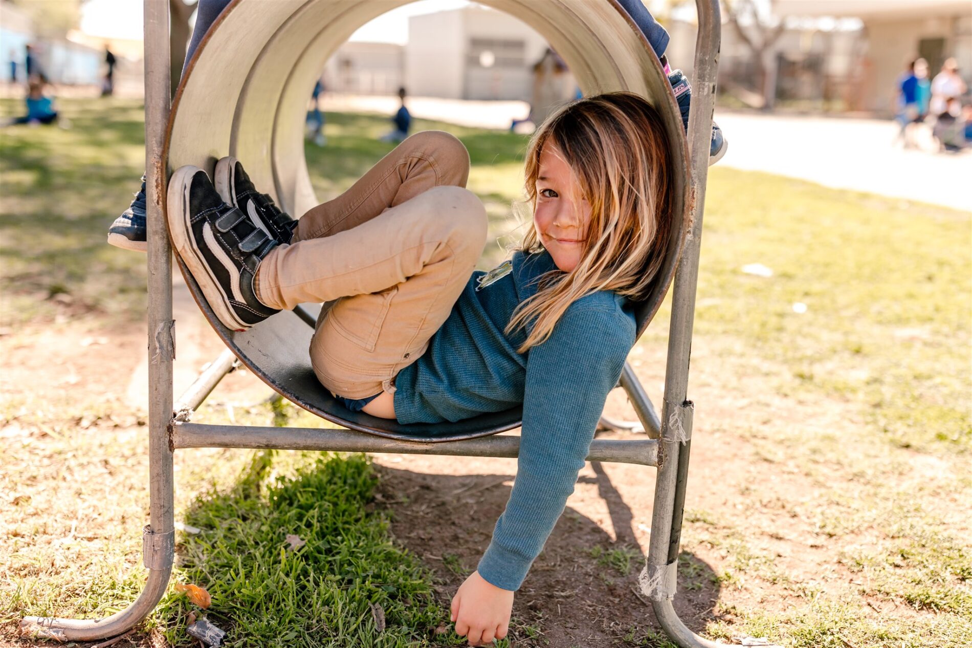 A Kavod explorer enjoying the San Diego sunshine curled up on campus at our tuition-free charter school.