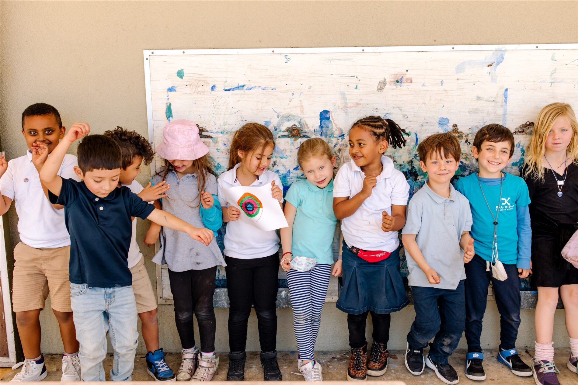 A joyful group of young Kavod Charter School explorers all lined up, excited to take on the day.