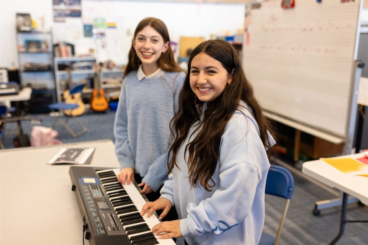 Kavod Charter School students playing musical keyboard