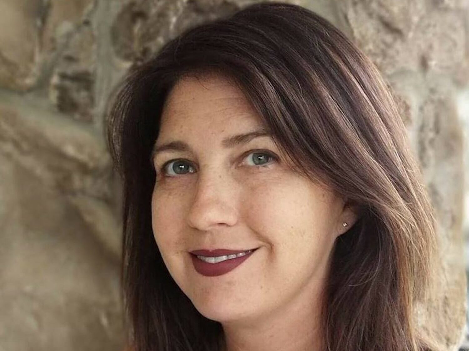 Headshot of Alexa Greenland, Executive Director of Kavod