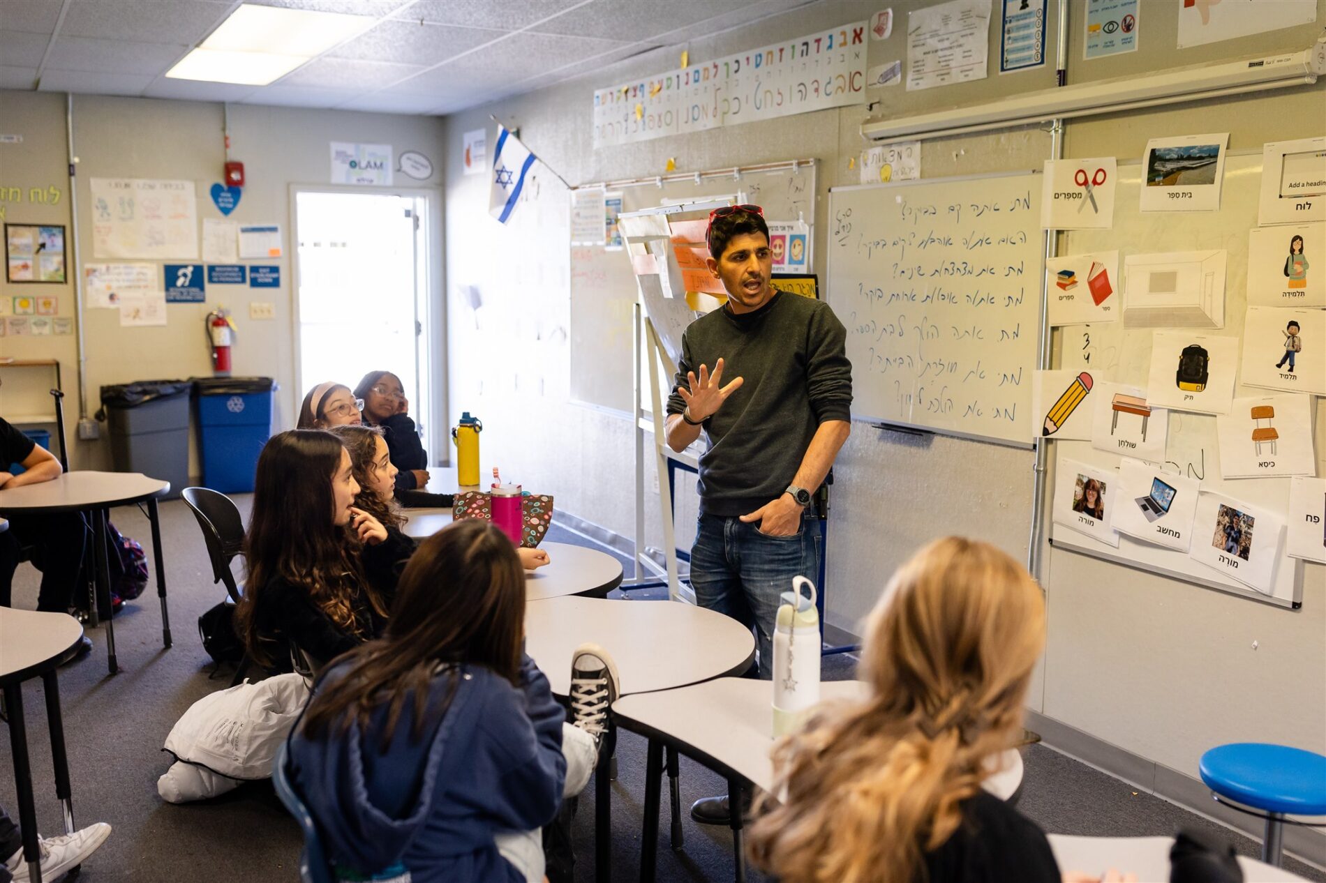 A Kavod Charter School teacher speaks to students in a classrom
