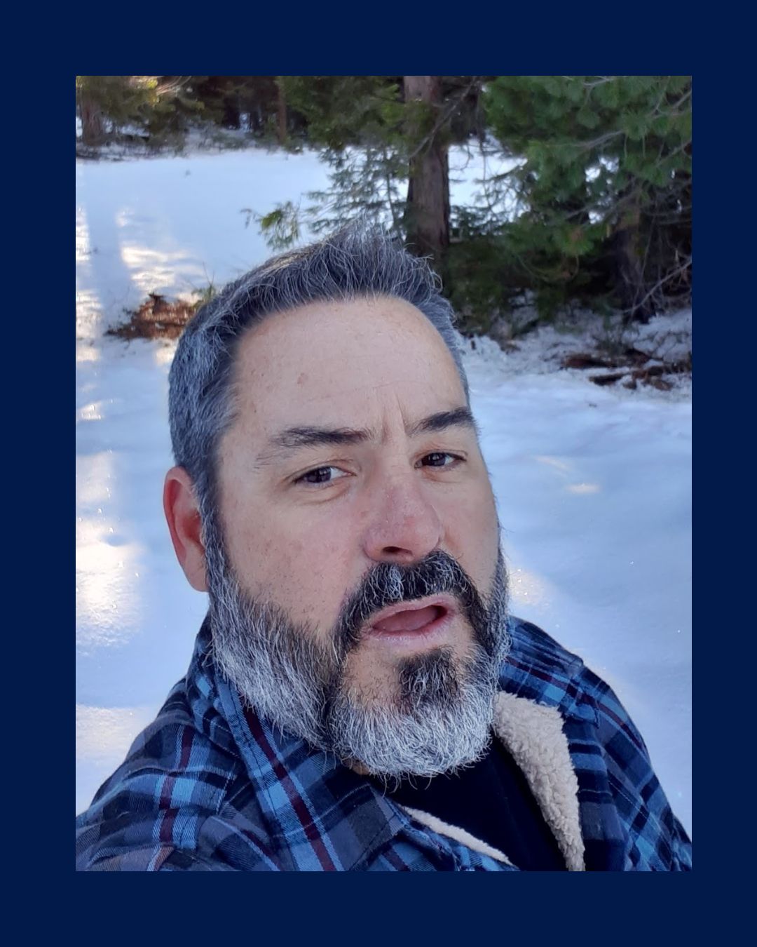 Kavod’s Coach McKerring poses for a picture outside in the snow.