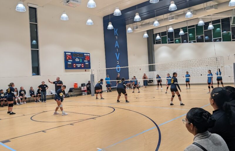 girls volleyball game in Kavod Charter School gymnasium