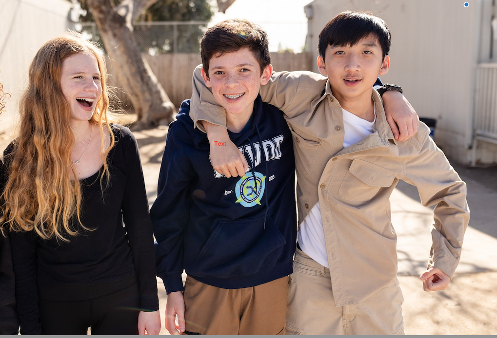 3 Kavod Charter School Middle School Students smile for the camera