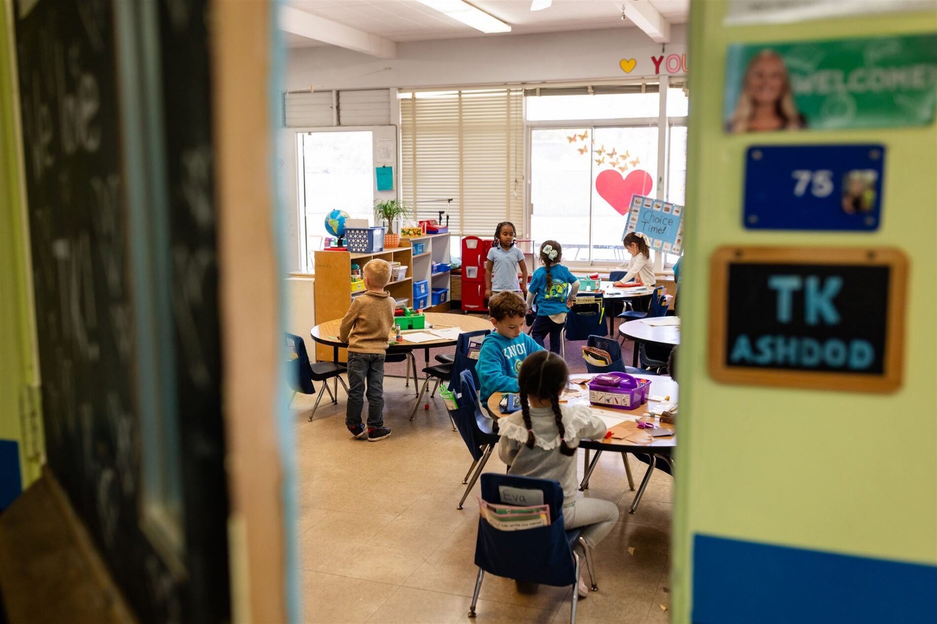 The door is cracked and we get a peek into the Kavod classroom where students are working independently at their tables.
